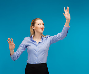 Image showing woman working with something imaginary