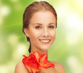 Image showing lovely woman with red lily flower