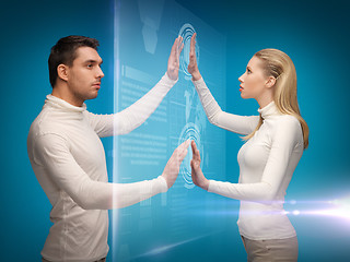 Image showing man and woman working with virtual screens