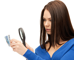 Image showing woman with magnifying glass and euro cash money