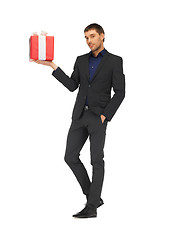 Image showing handsome man in suit with a gift box