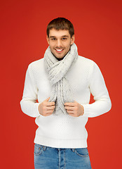 Image showing handsome man in warm sweater and scarf