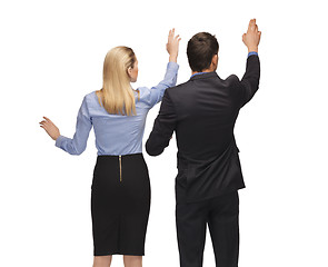 Image showing man and woman working with something imaginary