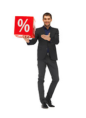 Image showing handsome man in suit with percent sign