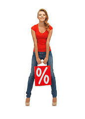 Image showing teenage girl in red t-shirt with shopping bag