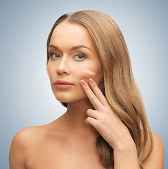 Image showing woman applying foundation