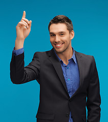 Image showing man in suit with his finger up