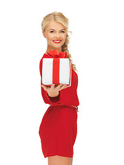 Image showing lovely woman in red dress with present