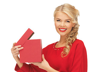 Image showing lovely woman in red dress with opened gift box