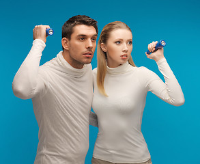 Image showing man and woman with pocket flashlights