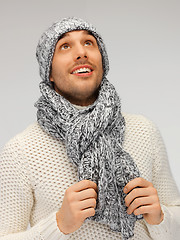 Image showing handsome man in warm sweater, hat and scarf