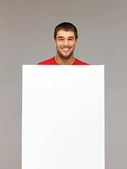 Image showing handsome man with big blank board