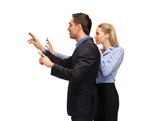 Image showing man and woman working with something imaginary