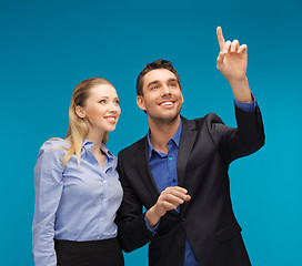 Image showing man and woman working with something imaginary