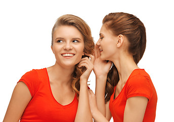 Image showing two talking teenage girls in red t-shirts