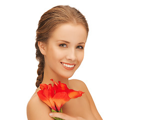 Image showing lovely woman with red lily flower