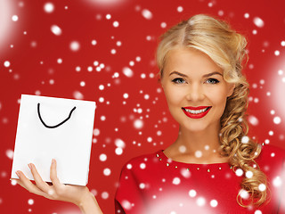 Image showing lovely woman in red dress with shopping bag