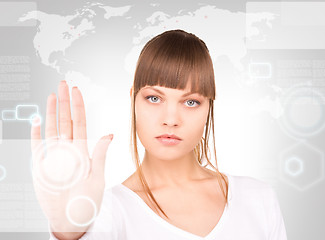 Image showing businesswoman working with touch screen