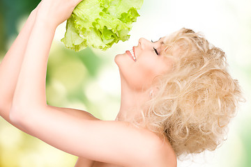 Image showing beautiful housewife with lettuce