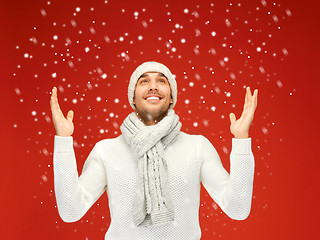 Image showing handsome man in warm sweater, hat and scarf