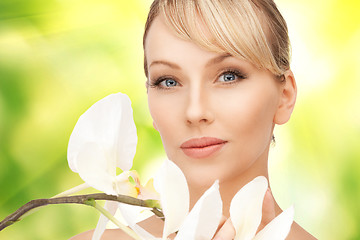 Image showing beautiful woman with orchid flower