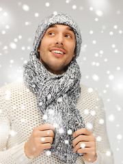 Image showing handsome man in warm sweater, hat and scarf