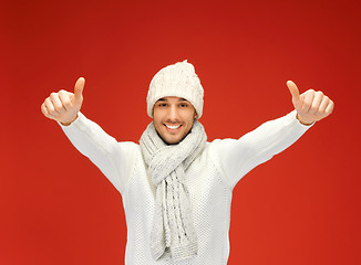 Image showing handsome man in warm sweater, hat and scarf