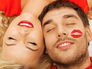 Image showing happy couple lying at home with closed eyes