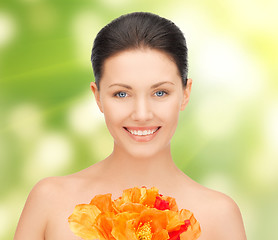 Image showing woman with red flowers