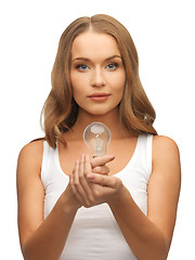 Image showing woman with energy saving bulb