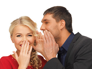 Image showing man and woman spreading gossip