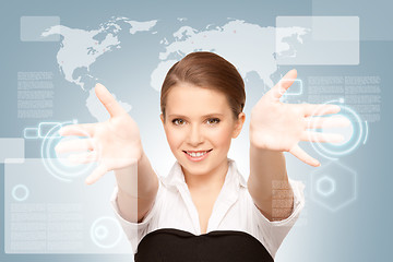 Image showing businesswoman working with touch screen