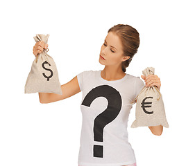 Image showing woman with dollar and euro signed bags