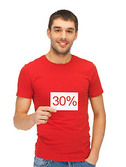 Image showing handsome man with discount card.