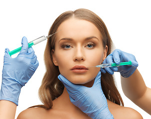 Image showing woman face and beautician hands