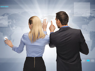 Image showing man and woman working with virtual touch screens