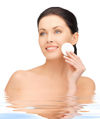 Image showing beautiful woman with cotton pad in water