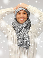 Image showing handsome man in warm sweater, hat and scarf