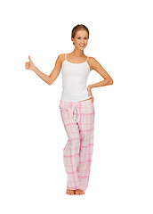 Image showing woman in cotton pajamas showing thumbs up