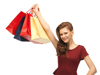 Image showing happy teenage girl with shopping bags