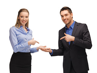 Image showing man and woman showing something on the palms