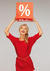 Image showing lovely woman in red dress with percent sign