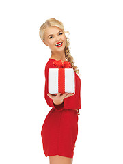 Image showing lovely woman in red dress with present