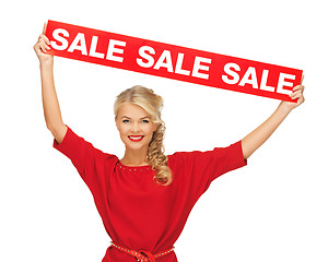 Image showing lovely woman in red dress with sale sign