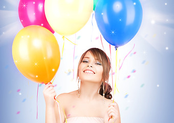 Image showing happy teenage girl with balloons