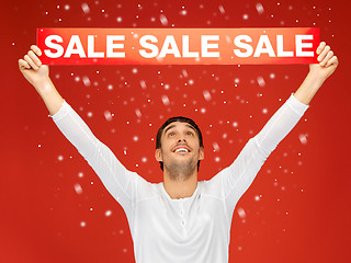 Image showing handsome man with sale sign