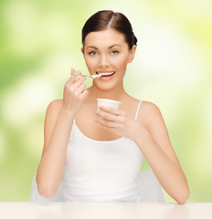 Image showing woman with yogurt