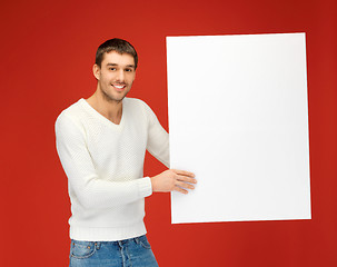 Image showing handsome man with big blank board