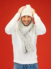 Image showing handsome man in warm sweater, hat and scarf