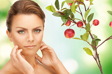 Image showing lovely woman with apple twig